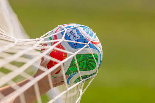 Calgary, Alberta, Canada. June 11, 2026. Hands retrieving an official FIFA tournament soccer ball from a white goal