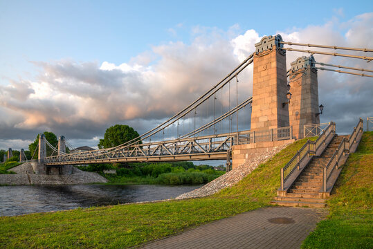 One of the spans of the ancient suspension bridge over the Velikaya River in the historical center of Ostrov, Pskov Region, Russia