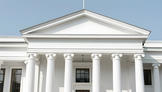 Classical Greek Revival Building Facade: Majestic white columns and triangular pediment define the elegant facade of a building, embodying neoclassical architectural grandeur under a clear blue sky.