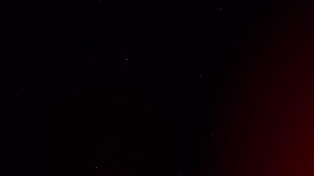 Vintage Super 8mm film scan overlay with organic dust scratches and red light leaks for cinematic nostalgic video production and retro aesthetic backgrounds 4k video