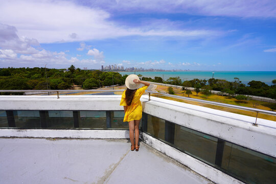 Tourism in Joao Pessoa, Brazil. Back view of woman in Estacao Cabo Branco belvedere, Joao Pessoa, Brazil.