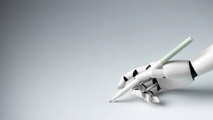 A white robotic hand elegantly holding a pen against a clean gray background. Concept of artificial intelligence, automation, creativity and text generation. © PixelArt_25