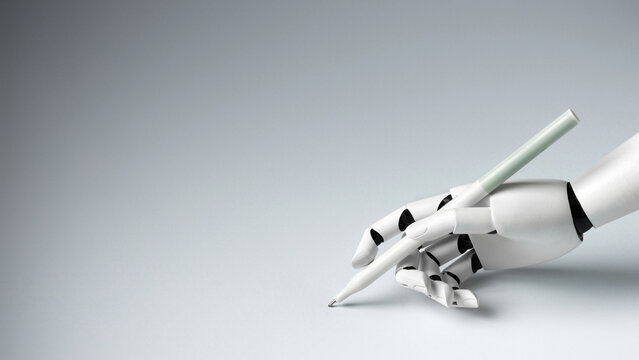 A white robotic hand elegantly holding a pen against a clean gray background. Concept of artificial intelligence, automation, creativity and text generation.