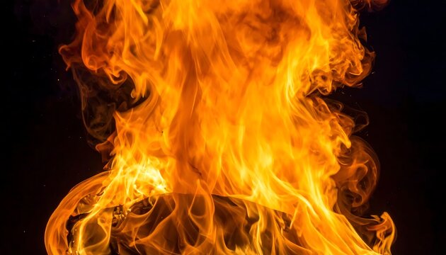 Intense orange and yellow fire flames close up.
