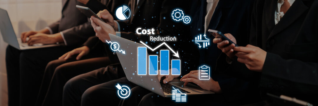 A business team analyzes cost reduction strategies using devices in a modern setting, illustrating collaboration for efficiency and growth in corporate environments. Trope
