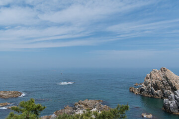 Fototapeta premium Tranquil Seascape with Rocky Coastline