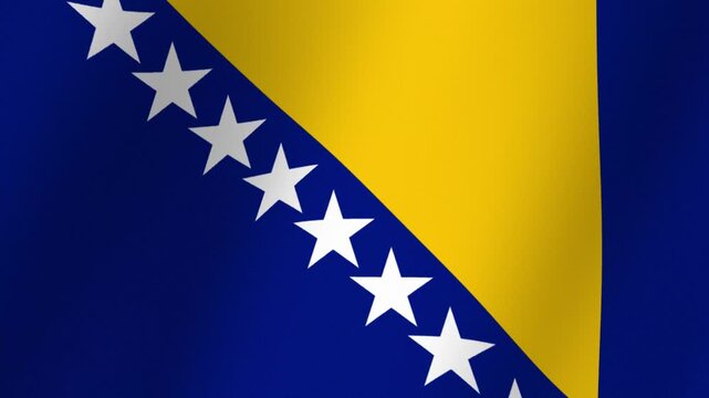 Close up of the national flag of Bosnia and Herzegovina waving in the wind with stars and yellow triangle