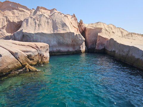 Stunning coastal landscape with dramatic rock formations and deep blue sea in Foca region, Turkish Riviera.