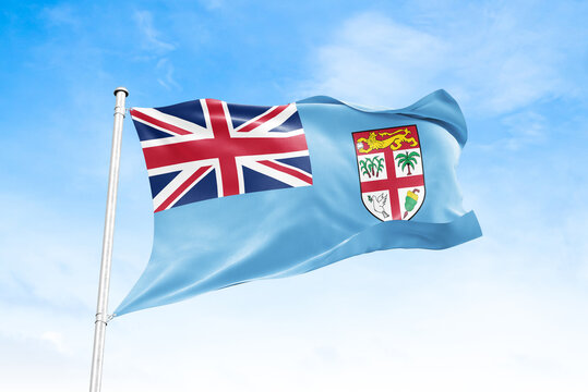 Fiji national flag waving against blue sky