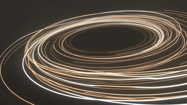 Abstract light trails forming continuous circular patterns in a dark environment, showcasing dynamic motion and fluidity through illuminated loops and spirals