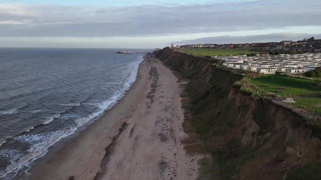 Aerial Drone View of East Runton Beach Cliffs and Caravan Park Near Cromer Norfolk England