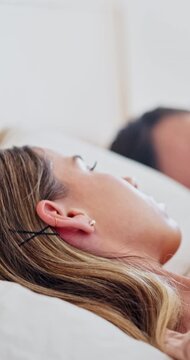 Couple, frustrated woman and marriage conflict in bed for sleeping, emotional distance or fight. Partner, resting and annoyed wife in home for unresolved argument, relationship tension and irritation