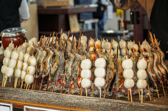 Salt-grilled ayu fish or Ayu Shioyaki and grilled mochi or Yakimochi with Japanese Trradition grill