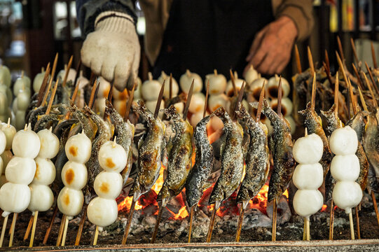 Salt-grilled ayu fish or Ayu Shioyaki and grilled mochi or Yakimochi with Japanese Trradition grill
