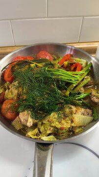 A dish of stewed vegetables in a frying pan. Selective focus.