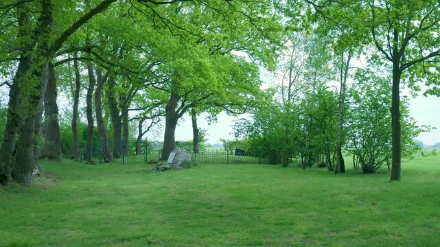 Lush green grove with an ancient megalithic stone memorial