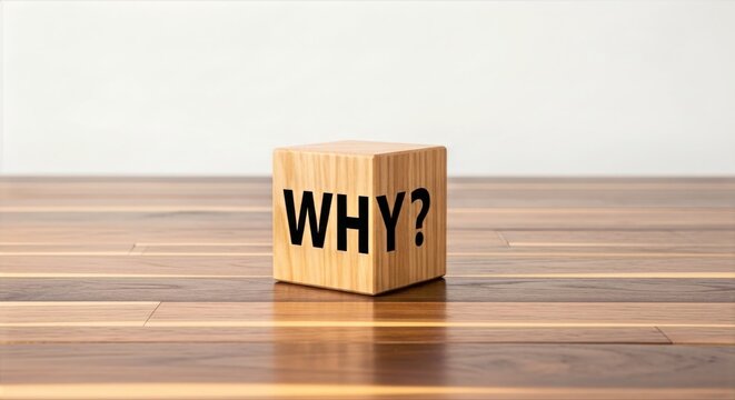 Wooden Cube with Why Word Printed on Wood Table Surface