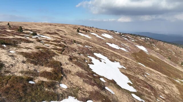 Scenic view great Jeseniky mountain glacial boiler Velka kotlina snow spring Vysoke hole drone aerial richest variety diversity plant animal communities botanical site slopes hills land Praded