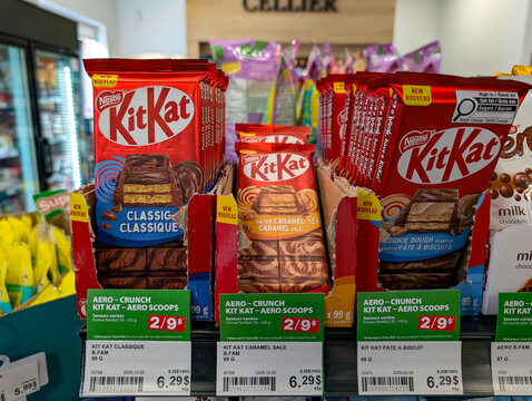 Quebec, Canada, 24 April 2026 : Nestle Kit Kat chocolate bars in various flavors are displayed for sale on a shelf in a retail store.