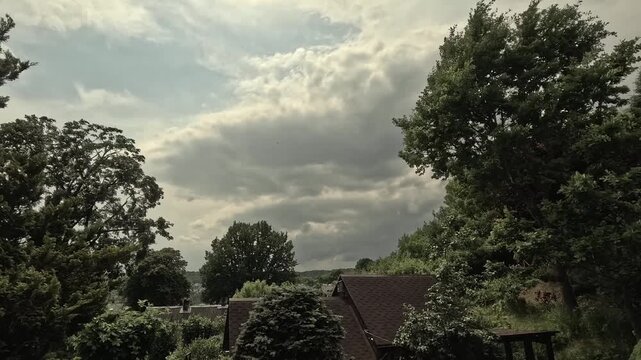 Storm clouds. Heavy rain and dark clouds are approaching, a summer thunderstorm. Timelapse.
