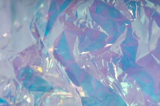 Y2K holographic background with crinkled plastic texture and iridescent pastel pastel colors