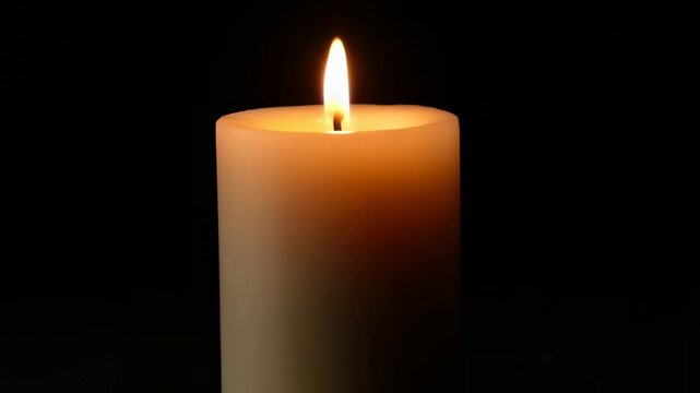 Candle flame flickering in dark room  calm, relaxing light changes during evening