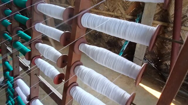 Close view of handloom bobbins.