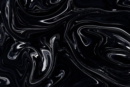 Swirling and shiny black material that looks like oil, latex, leather, plastic, satin or fluid. Abstract high resolution luxurious and glamorous background with metallic highlights.
