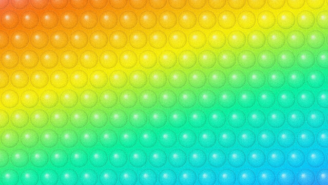 Bright colorful bubble wrap texture with a vibrant rainbow gradient pattern