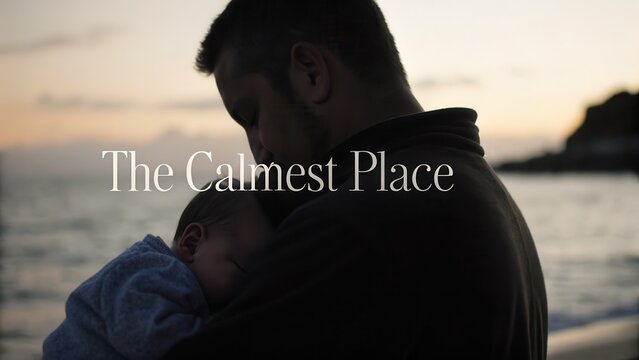 Peaceful Moment Between Father and Child at Sunset by the Ocean