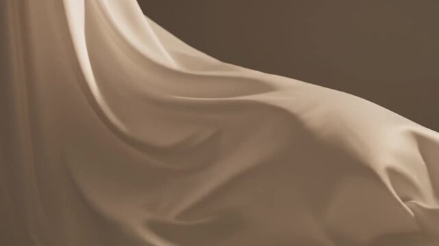 Flowing satin fabric in a soft beige or cream color with drapes and smooth, gentle folds creating a and serene visual texture with subtle highlights and shadows Keywords: fabric, satin, silk