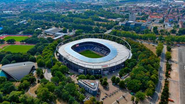 Aerial drone view of Heinz von Heiden Arena, Hannover 96 stadium, surrounded by Eilenriede forest and athletics tracks, Hannover, Germany