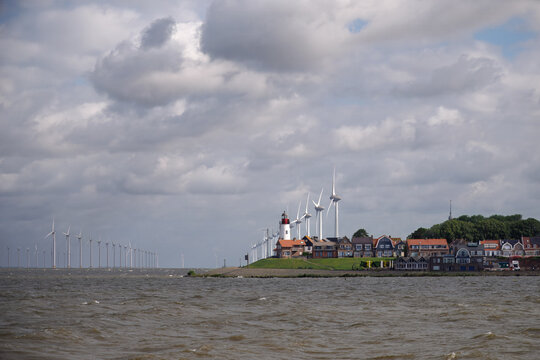 Wind turbines stretching out over the skyline of Urk