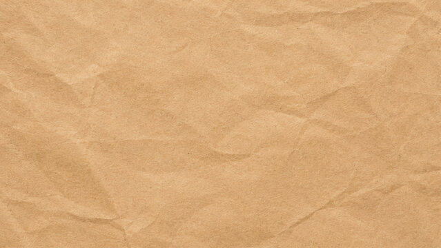 Crinkled brown paper texture, close-up studio shot.