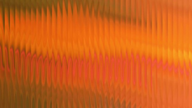 Vibrant orange and dark vertical wave pattern with rhythmic flowing lines and warm light effects