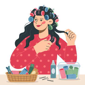Woman putting hair rollers in her hair at home