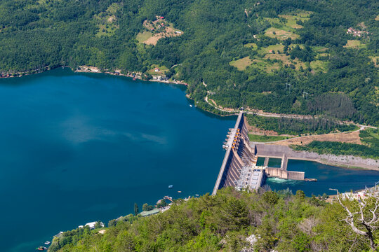 Spectacular high angle perspective of the Bajina Basta dam on the Drina River viewed from a steep cliff overlook in Tara National Park Serbia