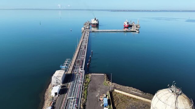 Aerial view of lng tanker ships at industrial port terminal