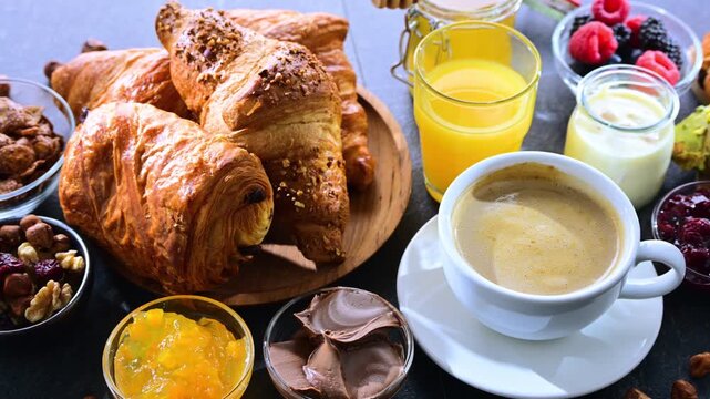 Italian breakfast served with croissants, orange juice, coffee and sweet extrass.
