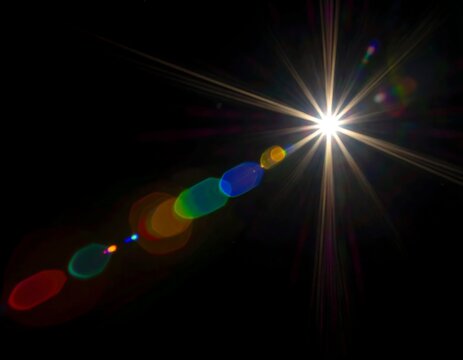 Abstract microscopic image of bright glowing particles in dark space.