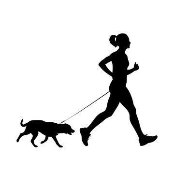 Woman jogging with her dog on a leash through the neighborhood on a clear and energetic morning.