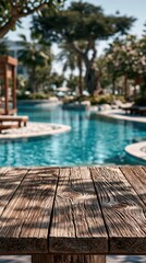 Obraz premium Empty Wooden Table on Sunny Tropical Swimming Pool Background With a relaxing resort feel