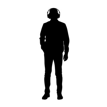 Listener wearing large headphones stands still in this dark silhouette against white background.