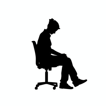 Employee sits alone on an office chair while reflecting in a somber black silhouette composition.