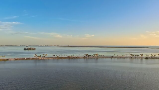 Aerial View of Dunedin Causeway Bridge and Waterfront Condos at Sunset, Florida