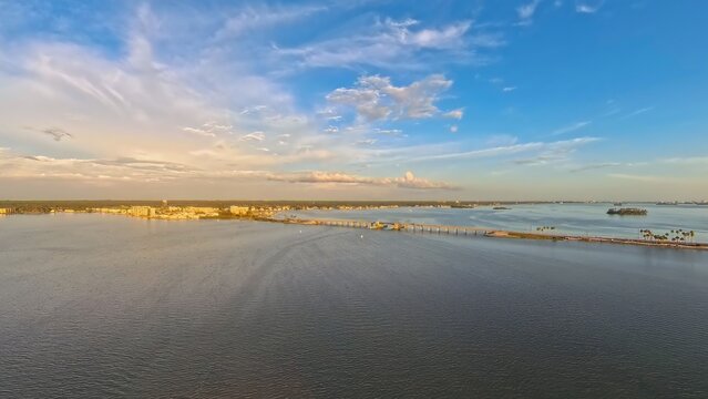 Aerial View of Dunedin Causeway Bridge and Waterfront Condos at Sunset, Florida