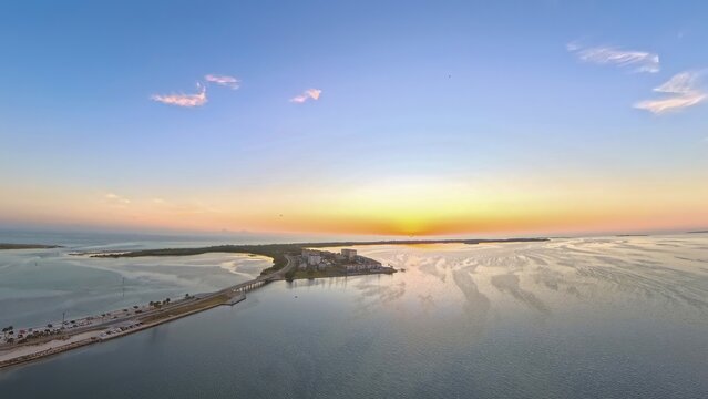 Aerial View of Dunedin Causeway Bridge and Waterfront Condos at Sunset, Florida