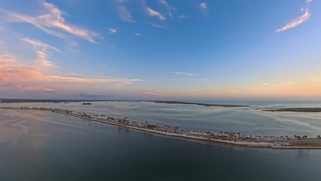 Aerial View of Dunedin Causeway Bridge and Waterfront Condos at Sunset, Florida