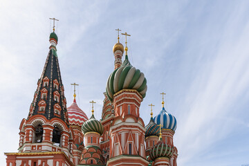 The painted domes of St. Basil's Cathedral against a blue sky. © Natalia