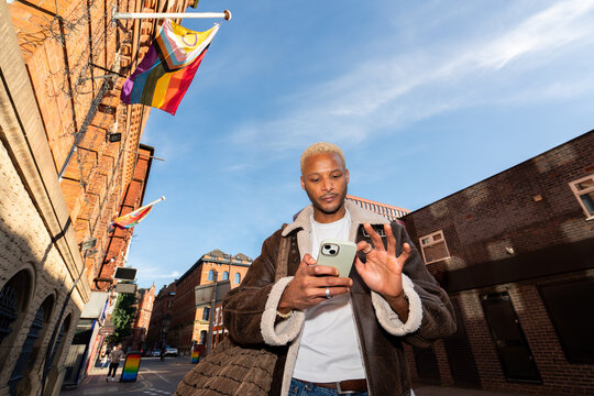 Stylish Man Using Phone in Gay Village In Manchester